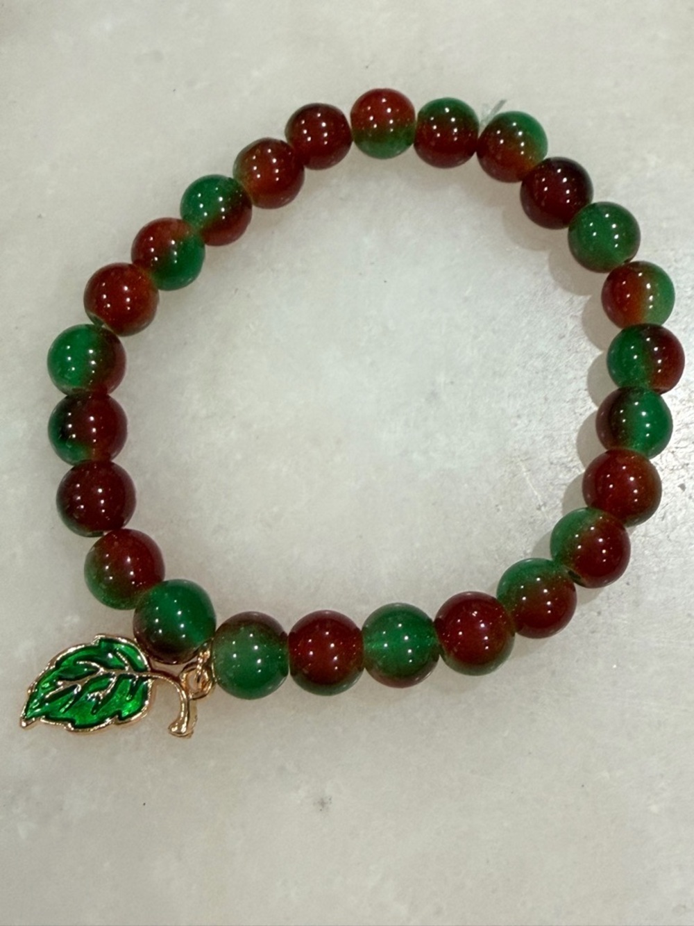 Green & Red Beaded Stretch Bracelet with Gold Leaf Charm